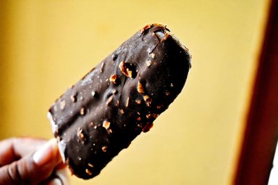 Close-up of hand holding ice cream