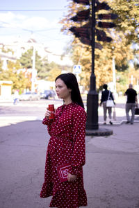 Young woman standing on street