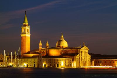 Illuminated cathedral against sky at night