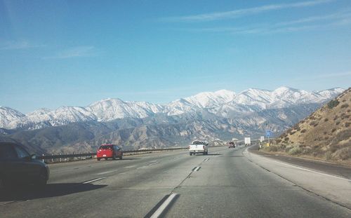 Country road leading towards mountains