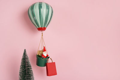 Close-up of christmas decoration against pink background