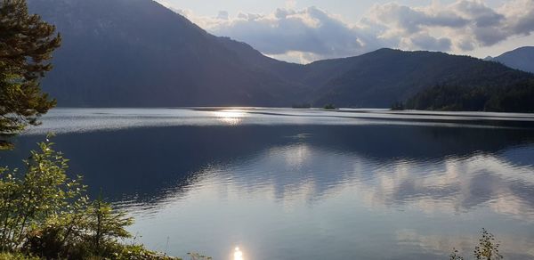 Scenic view of lake and mountains against sky