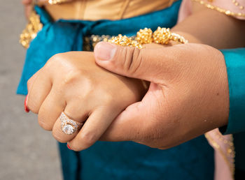 Close-up of woman holding hands