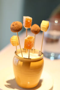 Close-up of candies in container on table