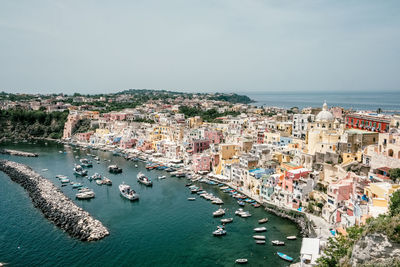 High angle view of townscape and sea against sky