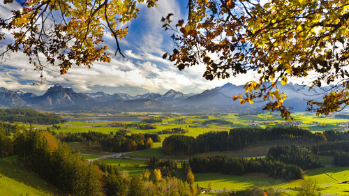 Scenic view of landscape and mountains against sky