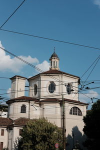 Low angle view of church against blue sky