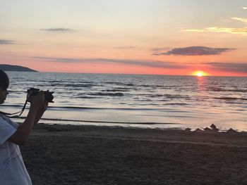 Scenic view of sea against sky during sunset