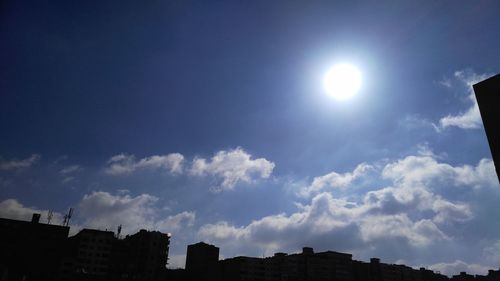 Low angle view of buildings against blue sky