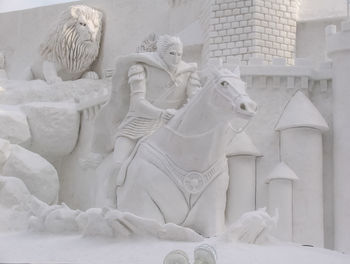 Low angle view of statue against building