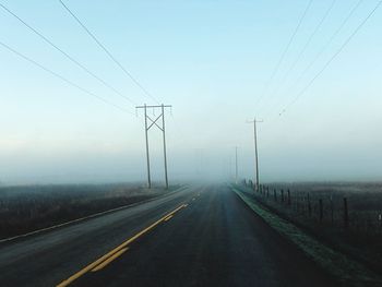 Road against sky during foggy weather