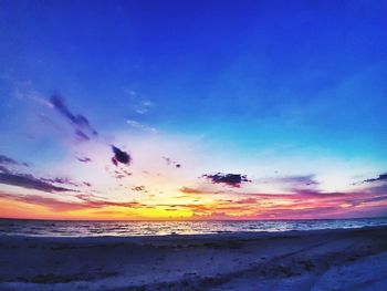 Scenic view of beach against sky during sunset