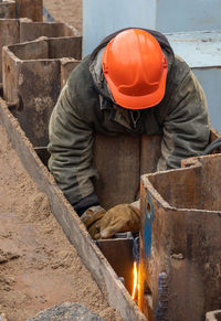 Man working on metal structure