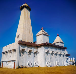 Low angle view of building against blue sky