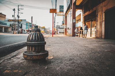 Close-up of fire hydrant on sidewalk in city