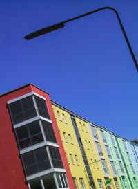 Low angle view of building against clear blue sky