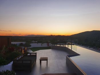 View of swimming pool against sky during sunset