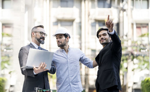 People standing in front of office building