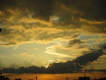 Low angle view of dramatic sky during sunset