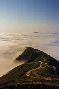 Scenic view of mountain against cloudy sky