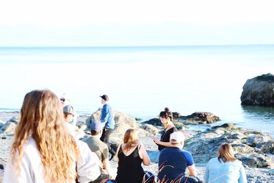 Rear view of people on beach