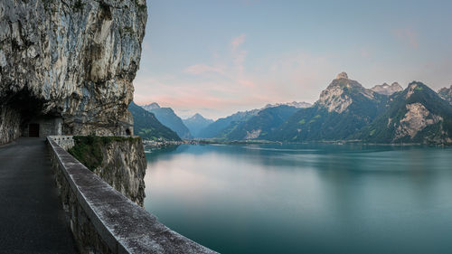 Scenic view of lake and mountains against sky