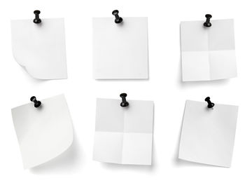 Low angle view of empty paper against white background