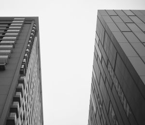 Low angle view of modern buildings against clear sky