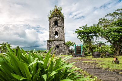 View of castle against cloudy sky