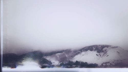 Scenic view of snow covered mountains