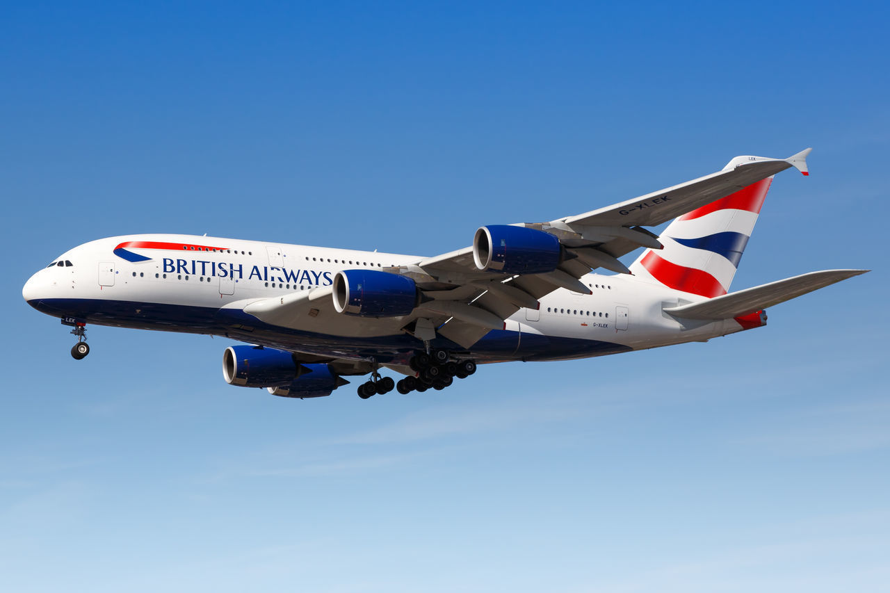 LOW ANGLE VIEW OF AIRPLANE AGAINST CLEAR SKY