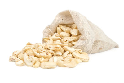 High angle view of bread in plate against white background