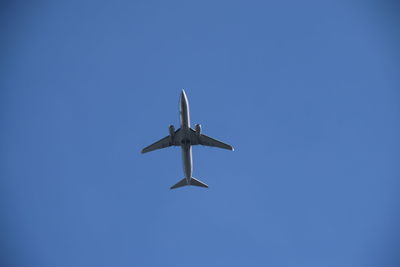 Low angle view of airplane against sky