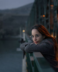 Portrait of woman standing in city