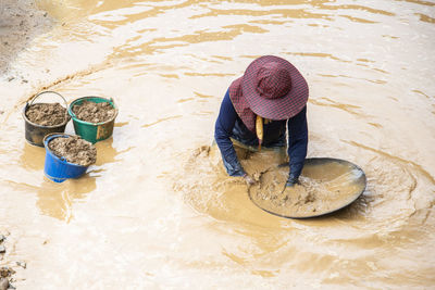 High angle view of man standing in water