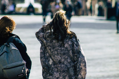 Rear view of woman standing in water