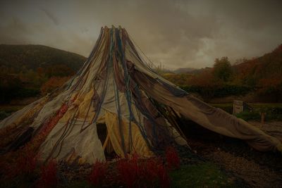 Panoramic view of tent on field against sky