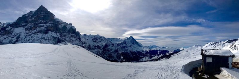 Scenic view of snowcapped mountains against sky