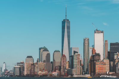 Skyscrapers in city against sky