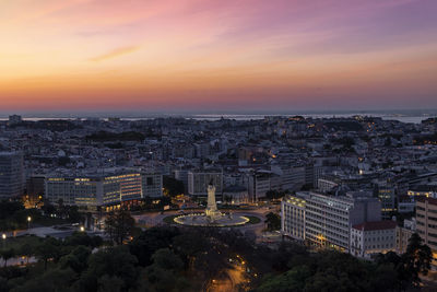 High angle view of townscape against sky during sunset