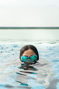 Portrait of woman swimming in pool