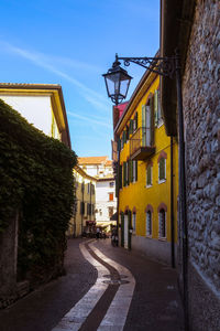 Narrow alley amidst buildings in city