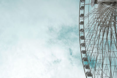 Low angle view of ferris wheel against sky