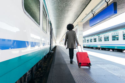 Tourist woman going for vacation trip on train