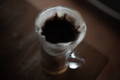 Close-up of coffee in glass on table