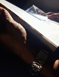 Close-up of hand holding book