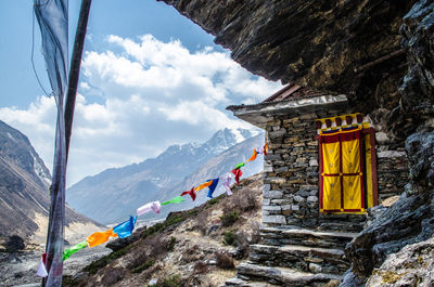 Scenic view of mountains against cloudy sky