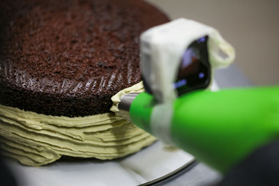 Cropped hand of person holding food