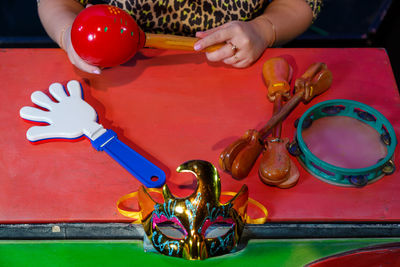 High angle view of boy playing with toy on table