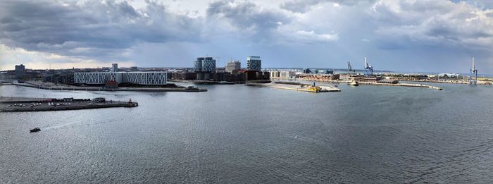 Panoramic view of sea and city against sky